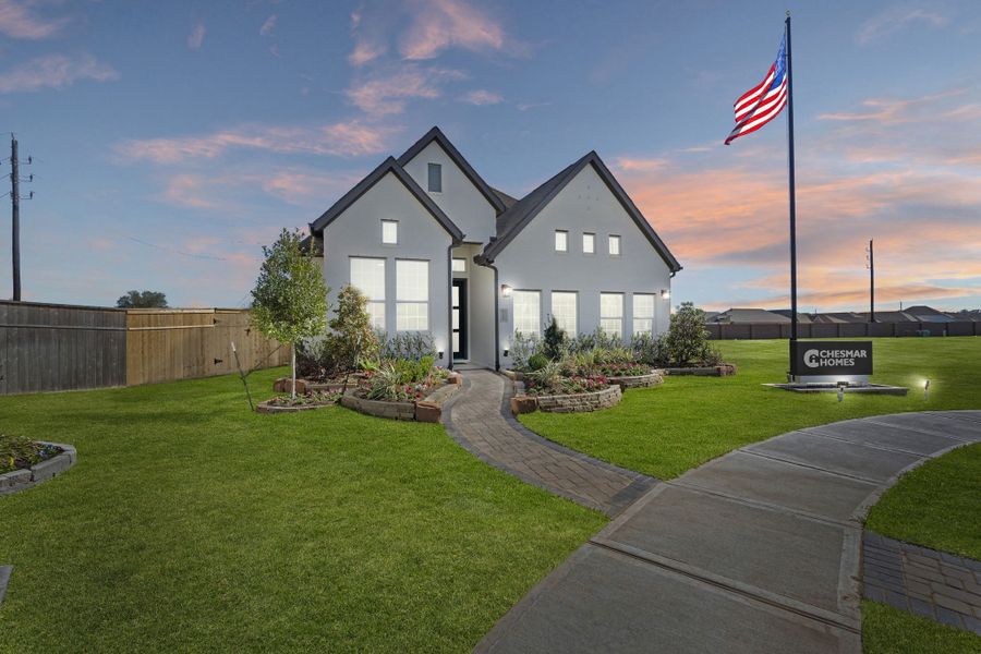 Front exterior of a new home in Sienna, Missouri City, TX, highlighting curb appeal (Image 23).