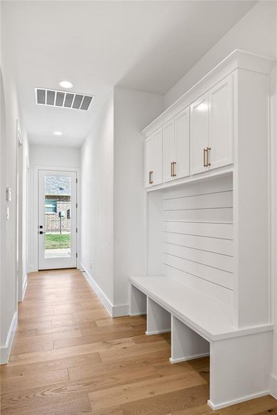 Mudroom featuring light wood-type flooring and recessed lighting Mudroom featuring light wood-type flooring and recessed lighting