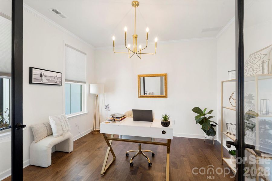 Office with French doors and upscale lighting Office with French doors and upscale lighting