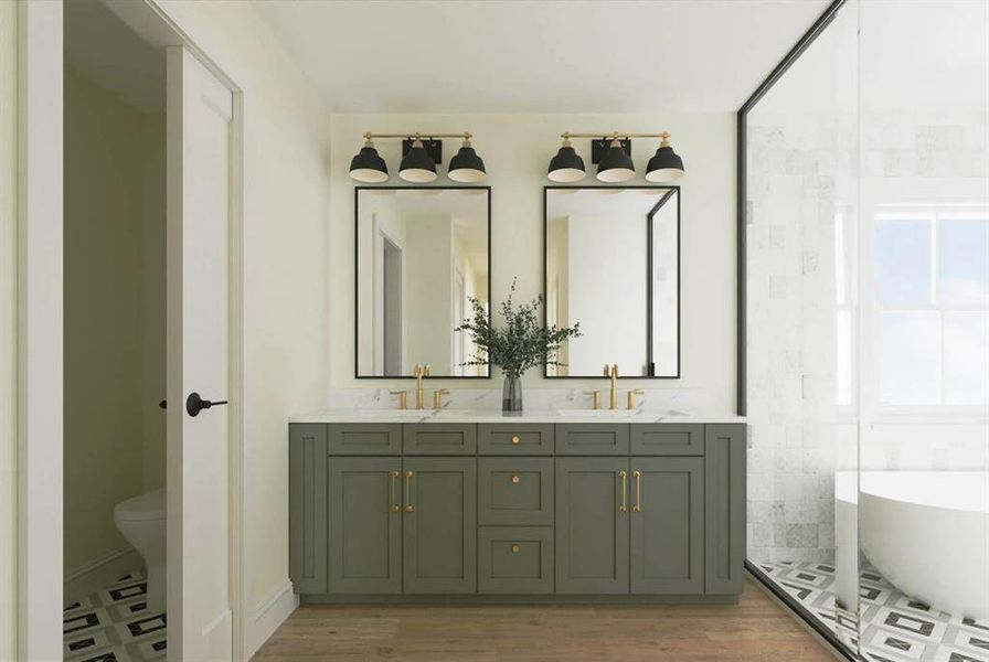 Full bath featuring a freestanding tub, double vanity, and light wood finished floors