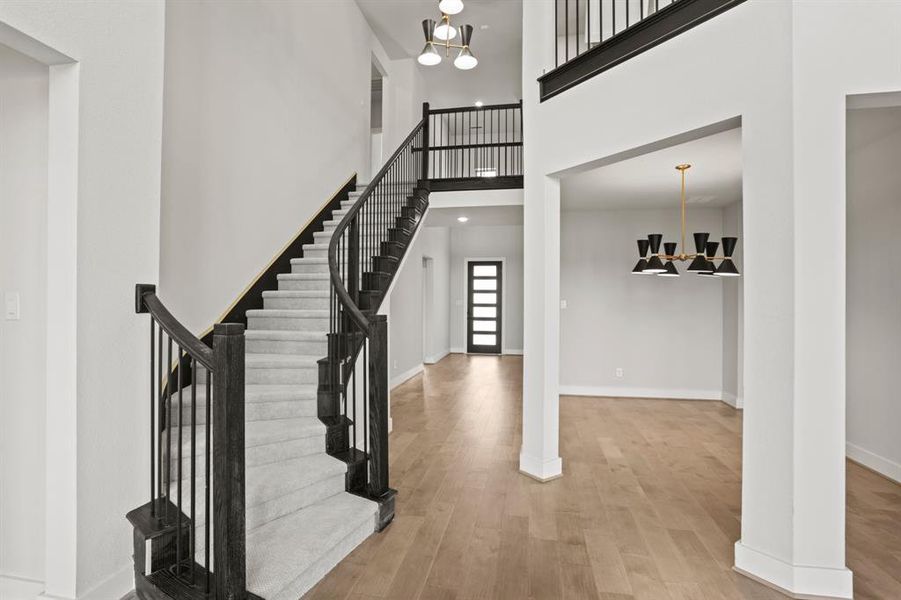 *REPRESENTATION PHOTO* The Winding Staircase & Hardwoods are a Centerpiece of Your Brand New Home