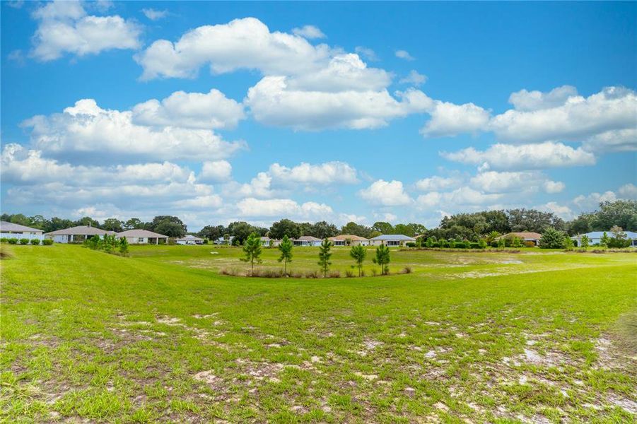 Overlooking dry retention pond.