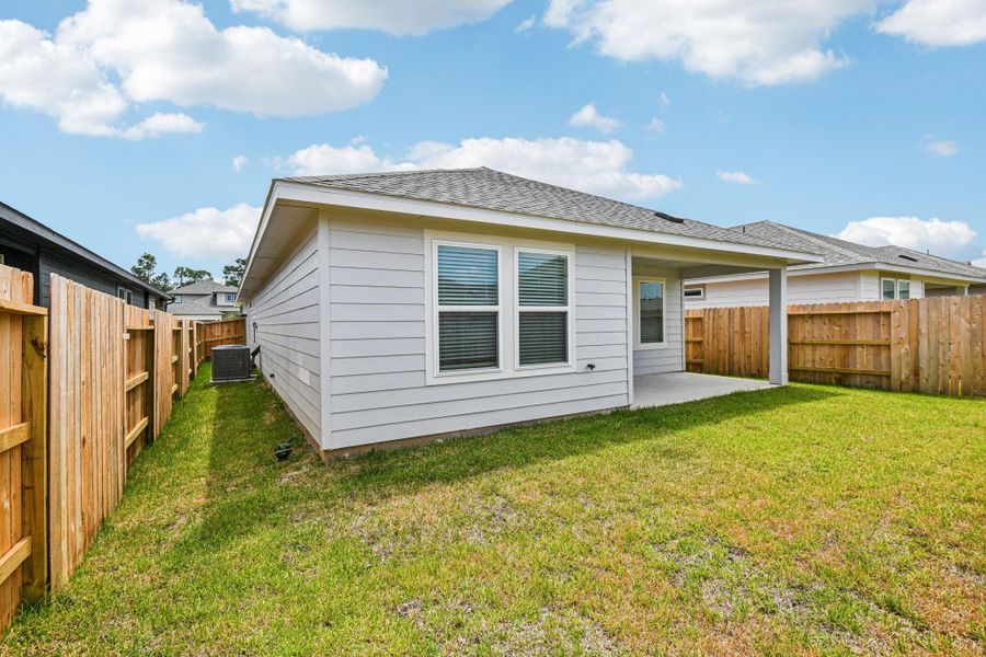 Front exterior of a new home in Mavera, Conroe, TX, highlighting curb appeal (Image 24). Front exterior of a new home in Mavera, Conroe, TX, highlighting curb appeal (Image 24).