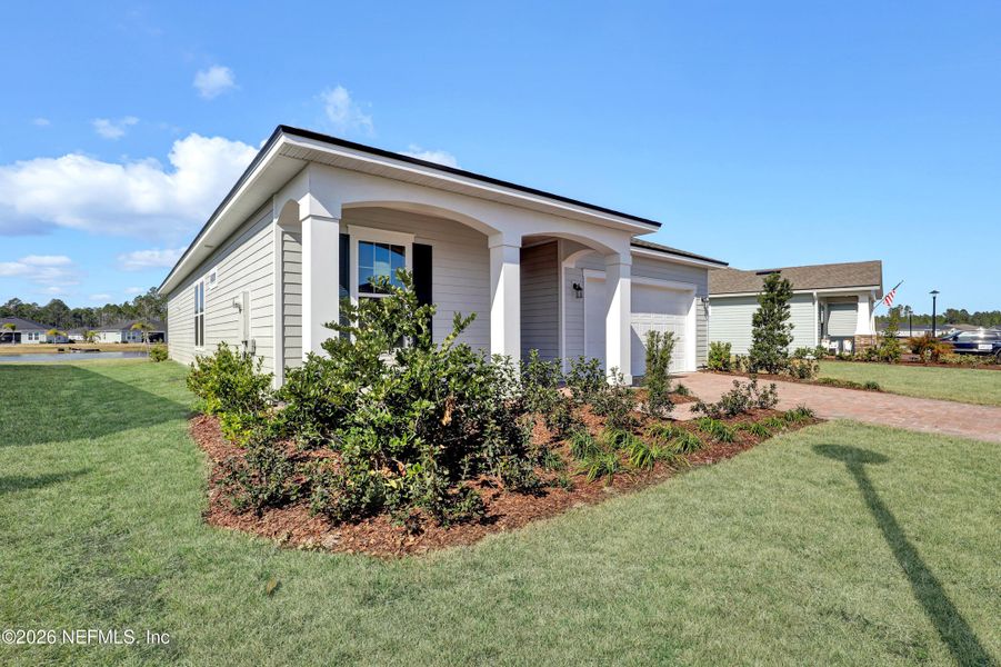 Exterior details and patio area of a home in New 55+ Active Adult Community in Palm Coast, Florida, Palm Coast (Image 3).