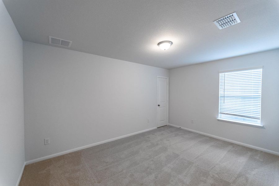 Unfurnished room featuring baseboards and light colored carpet