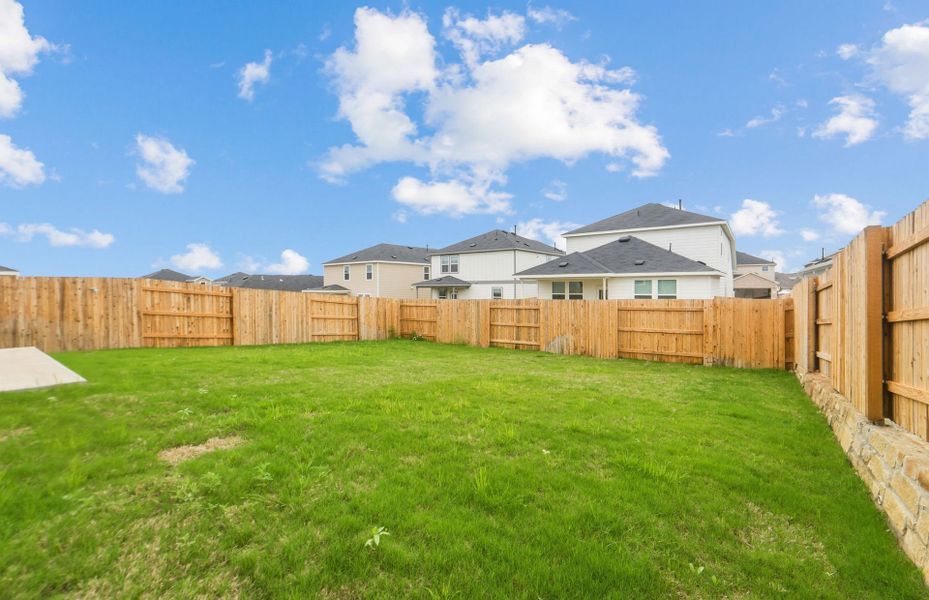 Exterior details and patio area of a home in Sunfield, Buda (Image 24).