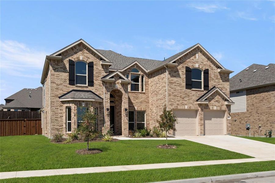 Front exterior of a new home in Grayhawk Addition, Forney, TX, highlighting curb appeal (Image 2). Front exterior of a new home in Grayhawk Addition, Forney, TX, highlighting curb appeal (Image 2).