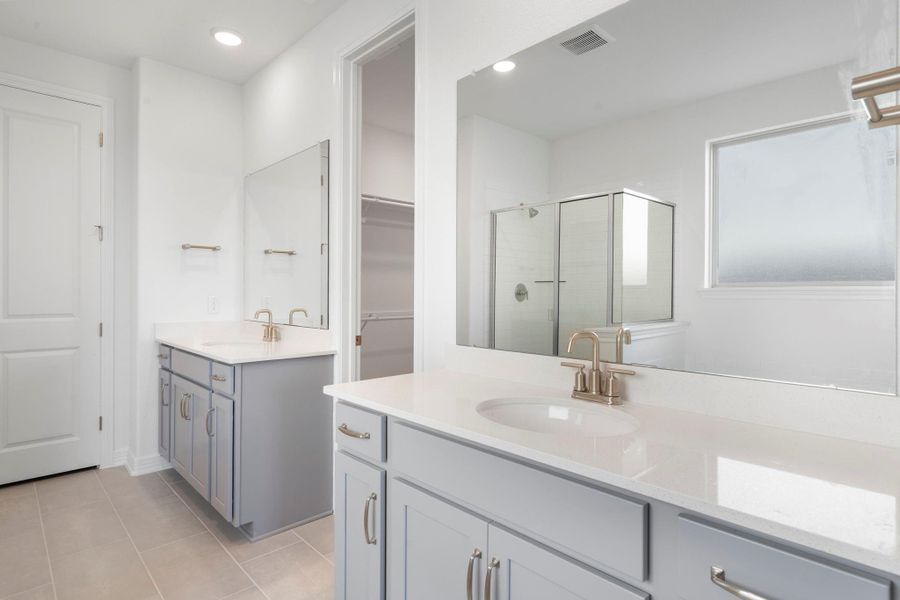 The en-suite bathroom offers a spa-like atmosphere with its elegant design, high end finishes, and tasteful lighting, creating a retreat within your own home. The en-suite bathroom offers a spa-like atmosphere with its elegant design, high end finishes, and tasteful lighting, creating a retreat within your own home.