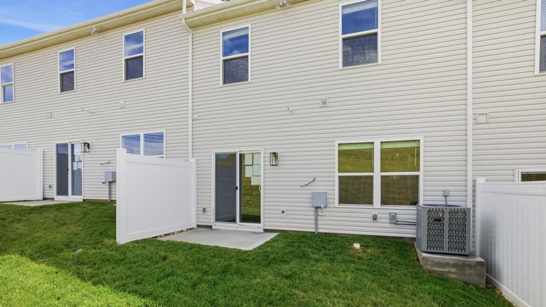 Exterior details and patio area of a home in Macon Townhomes, Seymour (Image 2). Exterior details and patio area of a home in Macon Townhomes, Seymour (Image 2).