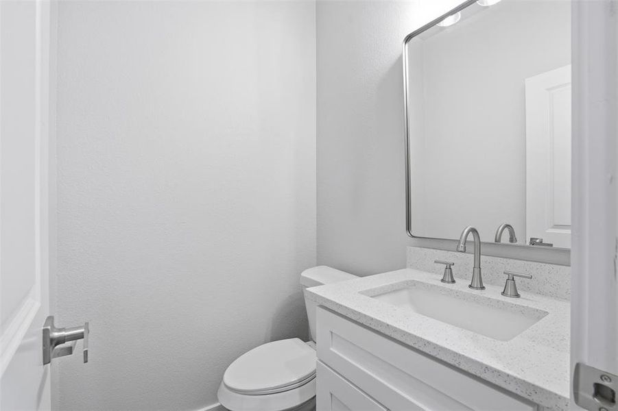 Contemporary vanity with a white countertop and integrated sink