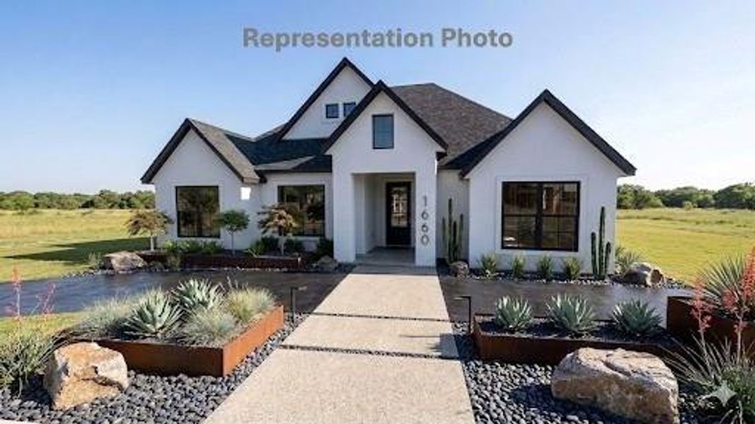 Contemporary single-story residence with a black shingle roof and white stucco exterior Contemporary single-story residence with a black shingle roof and white stucco exterior