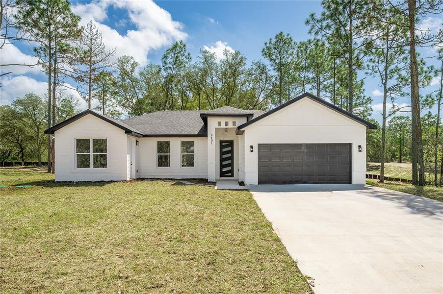 Front exterior of a new home in , Citrus Springs, FL, highlighting curb appeal (Image 31). Front exterior of a new home in , Citrus Springs, FL, highlighting curb appeal (Image 31).