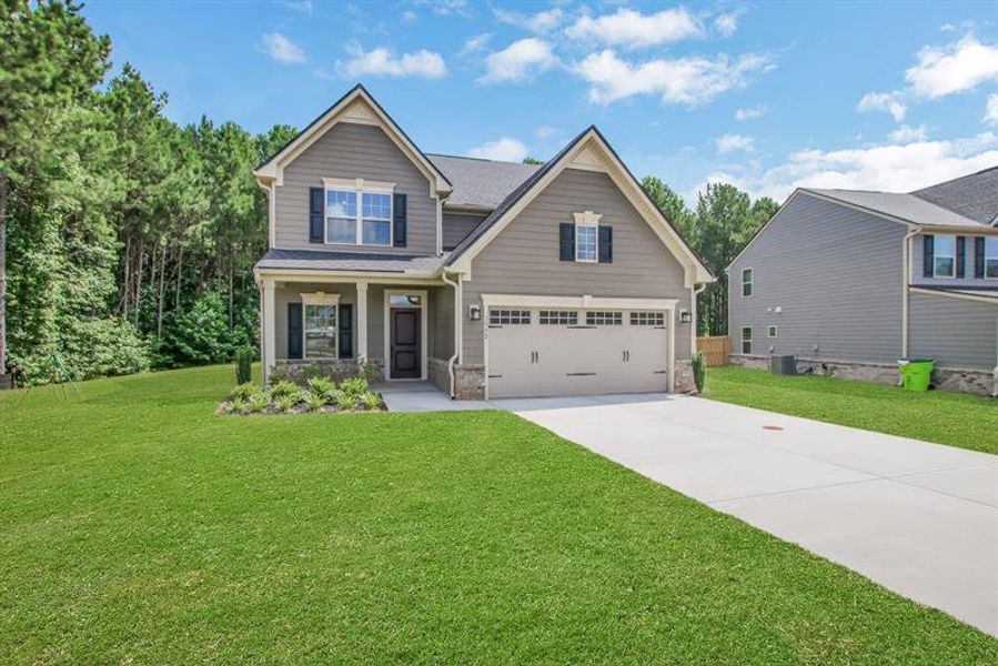 Front exterior of a new home in Southern Hills, McDonough, GA, highlighting curb appeal (Image 19). Front exterior of a new home in Southern Hills, McDonough, GA, highlighting curb appeal (Image 19).