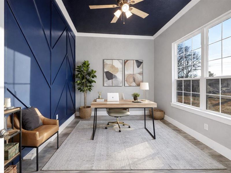 Home office featuring ornamental molding, ceiling fan, and wood finished floors Home office featuring ornamental molding, ceiling fan, and wood finished floors
