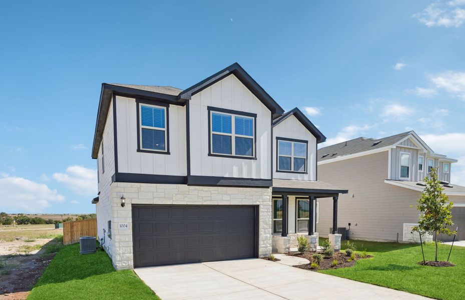 Front exterior of a new home in Sonterra, Jarrell, TX, highlighting curb appeal (Image 2). Front exterior of a new home in Sonterra, Jarrell, TX, highlighting curb appeal (Image 2).