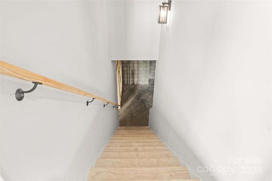 Stairs to basement showing the two sconce lights