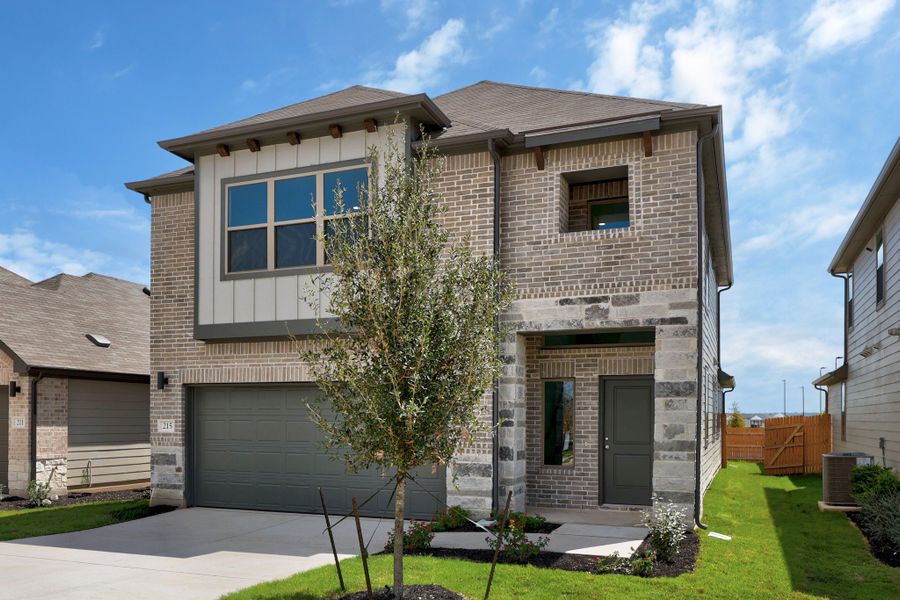 Front exterior of a new home in Trinity Ranch, Elgin, TX, highlighting curb appeal (Image 21).