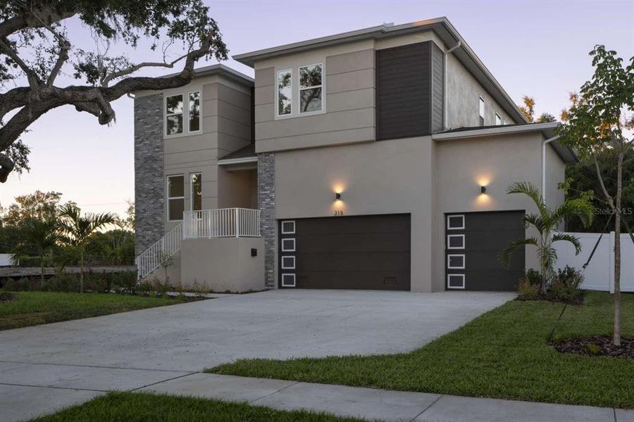 Front exterior of a new home in , St. Petersburg, FL, highlighting curb appeal (Image 1). Front exterior of a new home in , St. Petersburg, FL, highlighting curb appeal (Image 1).
