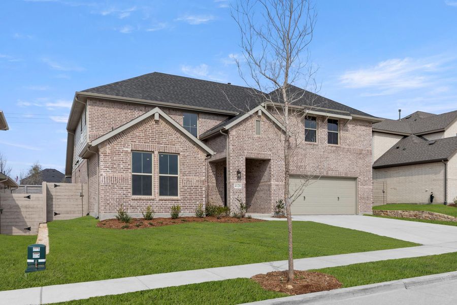 Front exterior of a new home in Painted Tree, McKinney, TX, highlighting curb appeal (Image 2). Front exterior of a new home in Painted Tree, McKinney, TX, highlighting curb appeal (Image 2).