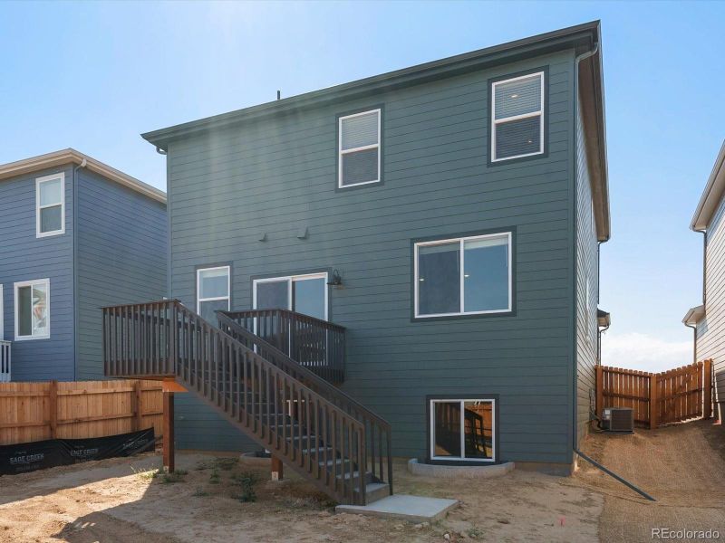 Front exterior of a new home in Lake Bluff, Greeley, CO, highlighting curb appeal (Image 1).