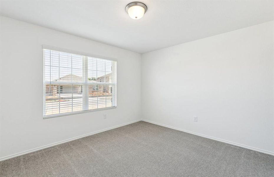 Spacious secondary bedroom with large windows Spacious secondary bedroom with large windows