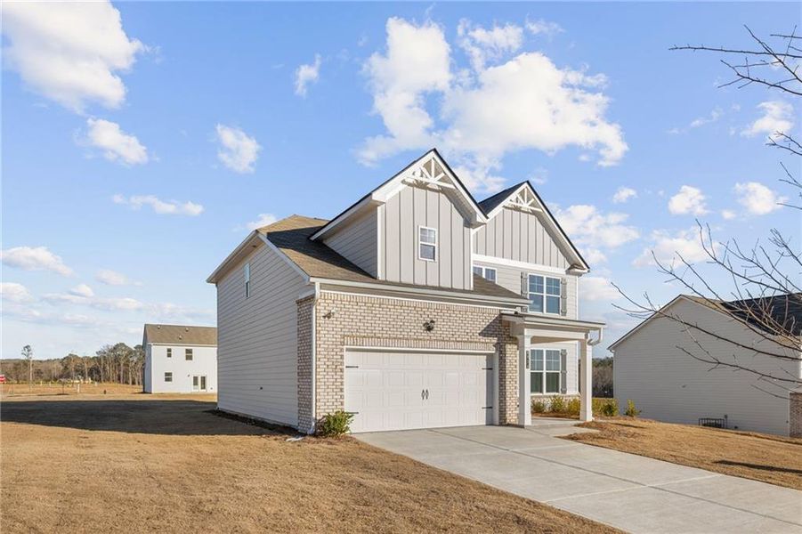 Front exterior of a new home in Highland Park, Stonecrest, GA, highlighting curb appeal (Image 15).