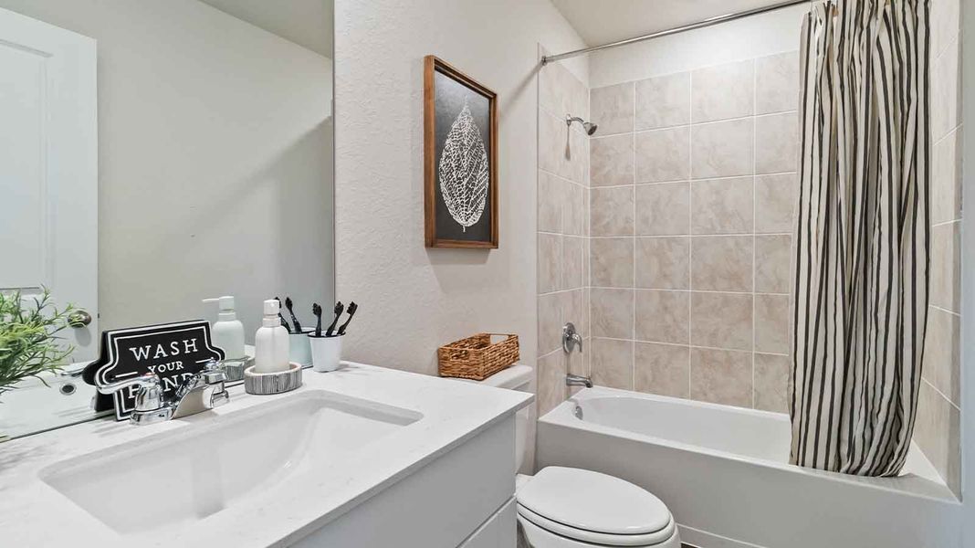 Representative furnished interior of a home built from the Barton by D.R. Horton in Watermark, Alvin (Image 14).