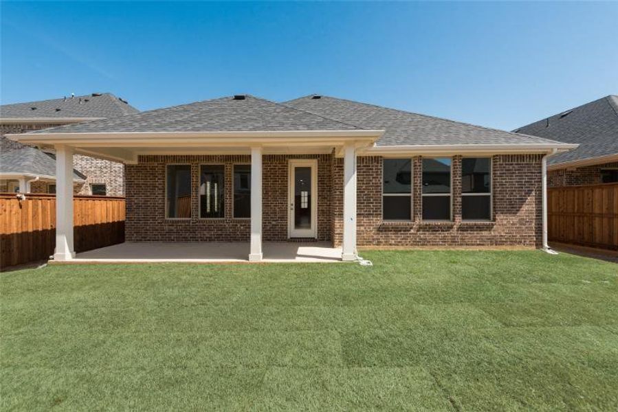 Exterior details and patio area of a home in Spiritas Ranch, Little Elm (Image 18).