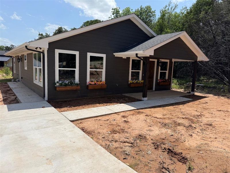 View of front of property with a patio area