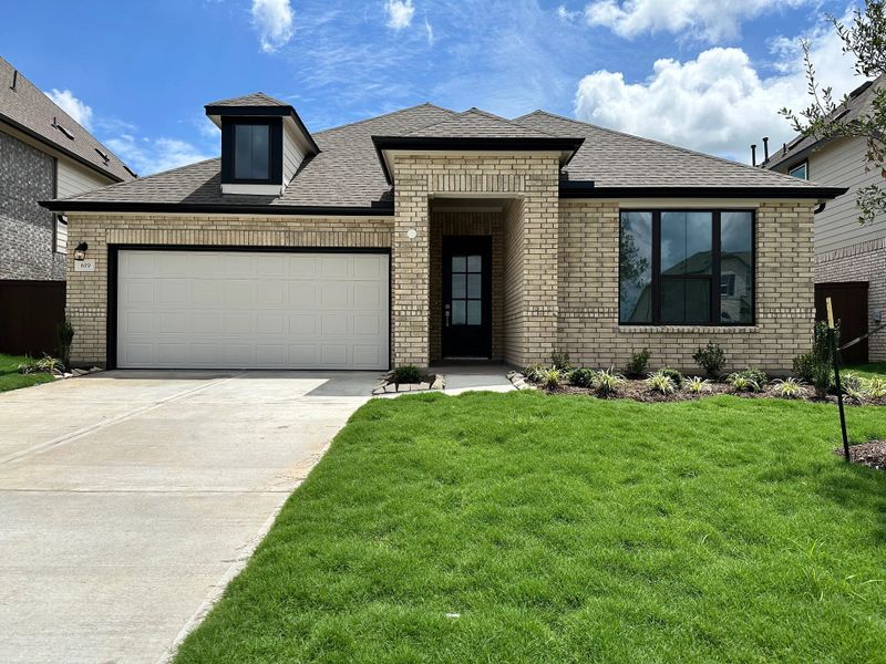 Front exterior of a new home in Brookewater, Rosenberg, TX, highlighting curb appeal (Image 1). Front exterior of a new home in Brookewater, Rosenberg, TX, highlighting curb appeal (Image 1).
