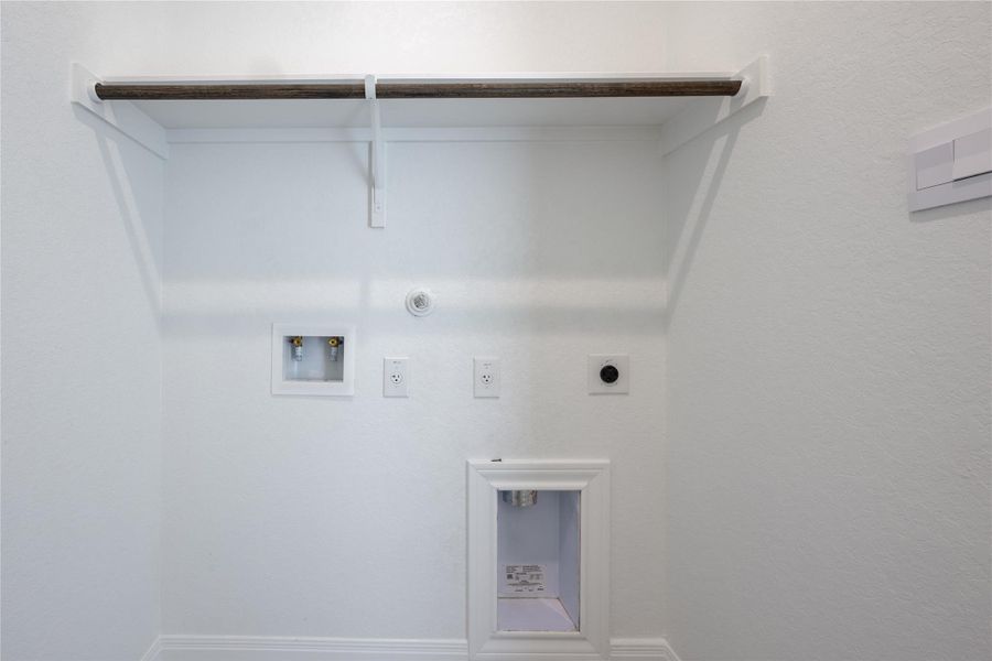 Washroom featuring hookup for a gas dryer, hookup for an electric dryer, and hookup for a washing machine Washroom featuring hookup for a gas dryer, hookup for an electric dryer, and hookup for a washing machine