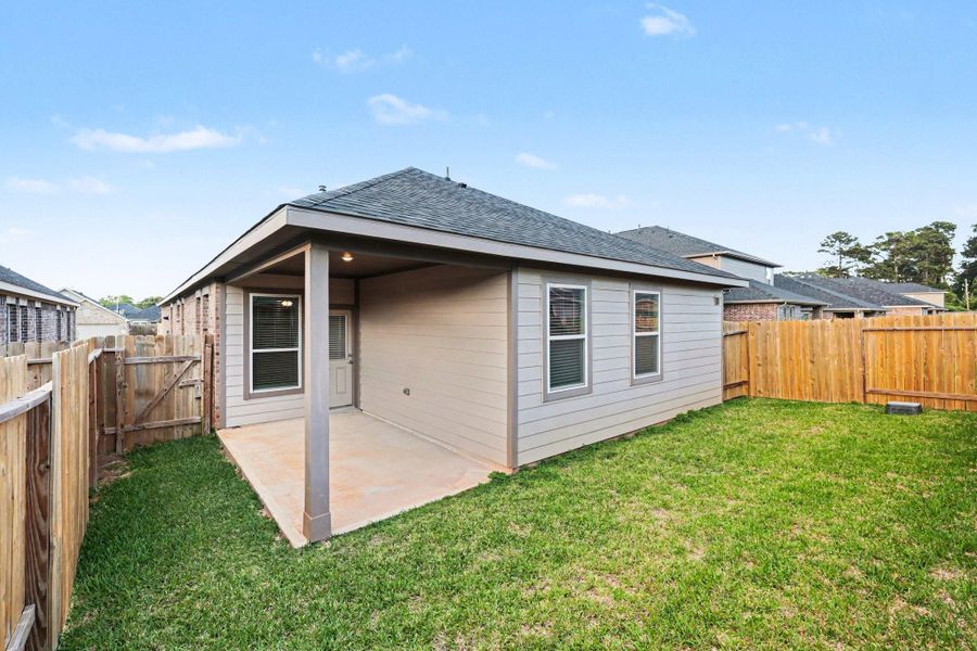 Fully fenced backyard with covered patio, ideal for outdoor entertaining Fully fenced backyard with covered patio, ideal for outdoor entertaining