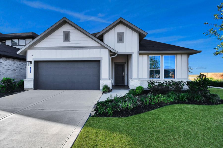 Front exterior of a new home in The Timbers at Mason Woods, Cypress, TX, highlighting curb appeal (Image 25).