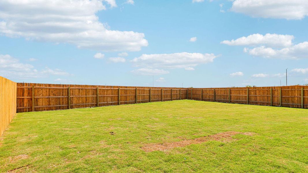 Exterior details and patio area of a home in Monarch Ranch, Manor (Image 19).