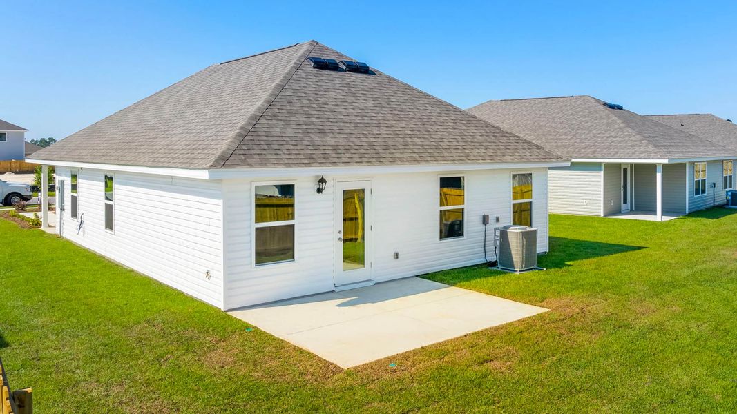 Front exterior of a new home in Park Place, Panama City, FL, highlighting curb appeal (Image 16). Front exterior of a new home in Park Place, Panama City, FL, highlighting curb appeal (Image 16).