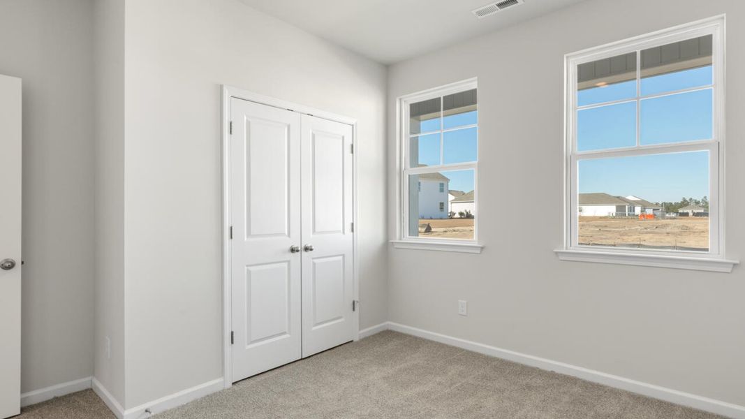 Spacious, unfurnished interior of a new home in Indigo Preserve, Leland (Image 27).