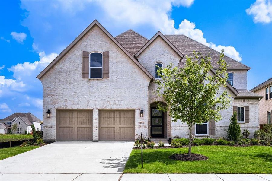 Stately brick exterior featuring a multi-gabled roofline and decorative shutters Stately brick exterior featuring a multi-gabled roofline and decorative shutters