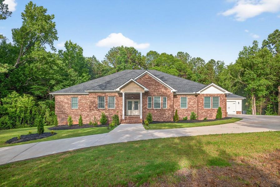 Front exterior of a new home in , Oxford, GA, highlighting curb appeal (Image 36). Front exterior of a new home in , Oxford, GA, highlighting curb appeal (Image 36).