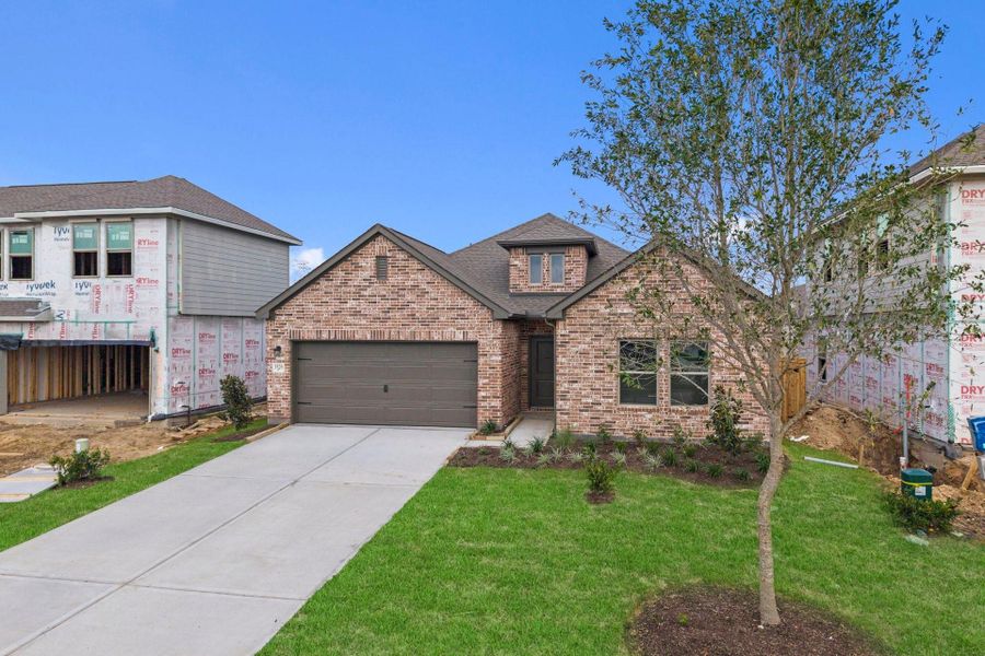 Front exterior of a new home in Windrose Green, Angleton, TX, highlighting curb appeal (Image 23).