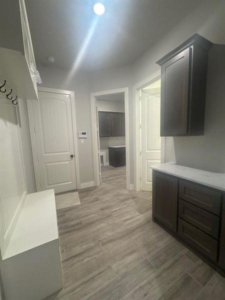 Mudroom with light wood finished floors