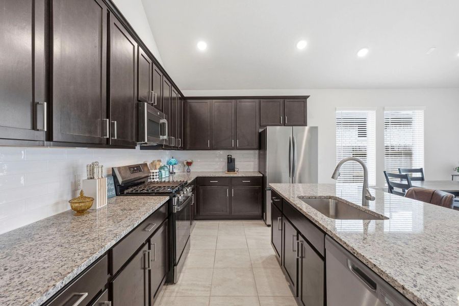 From granite countertops to stainless steel appliances, this kitchen blends style and functionality beautifully. From granite countertops to stainless steel appliances, this kitchen blends style and functionality beautifully.