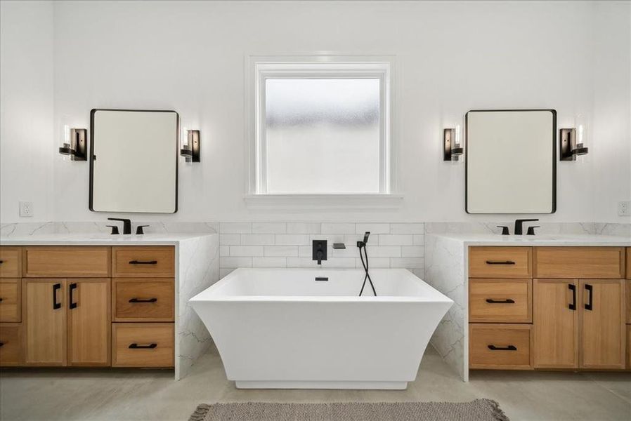 Bathroom with a bathtub and double vanity