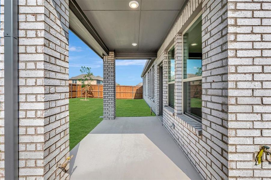 Exterior details and patio area of a home in Lily Creek at Sutton Fields, Aubrey (Image 3).