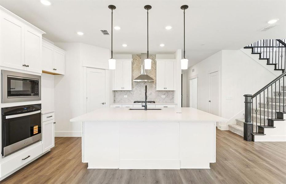 Spacious kitchen with eat-in bartop island