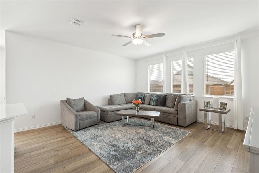 Family room has plenty of space for all your relaxing, movie watching, and entertaining needs.