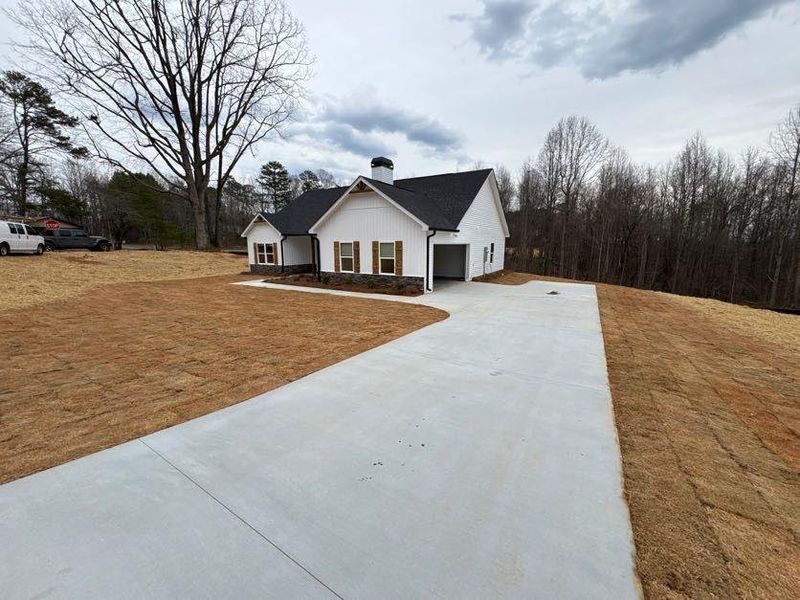 Front exterior of a new home in , Clarkesville, GA, highlighting curb appeal (Image 1).