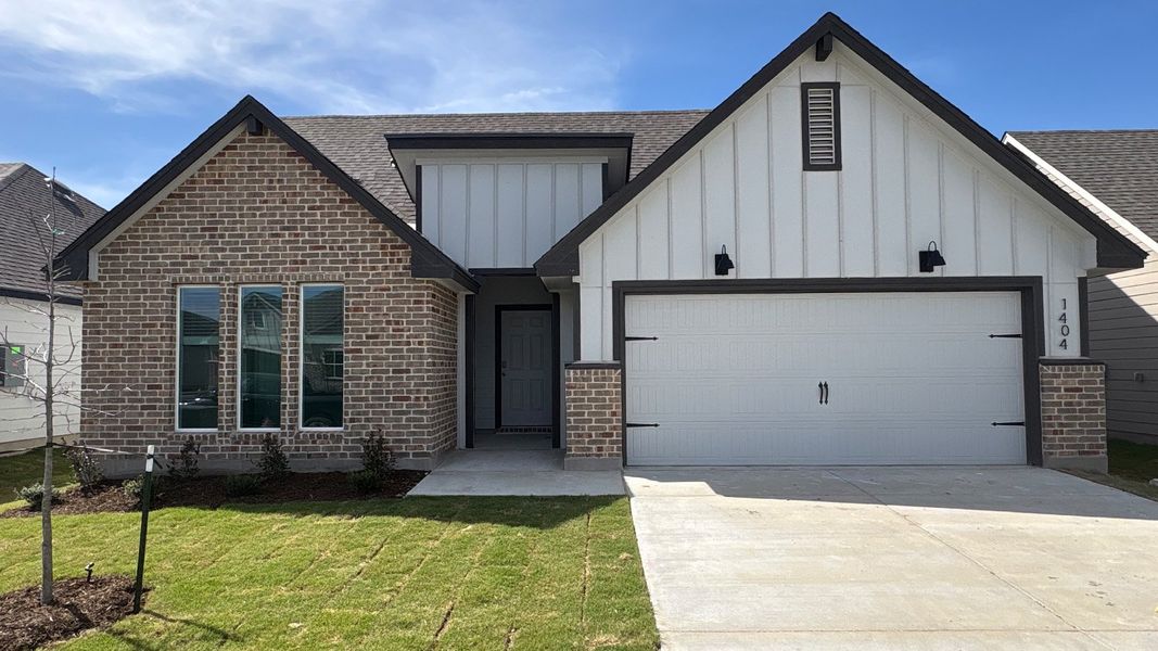 Front exterior of a new home in Oak Ridge, Temple, TX, highlighting curb appeal (Image 1). Front exterior of a new home in Oak Ridge, Temple, TX, highlighting curb appeal (Image 1).