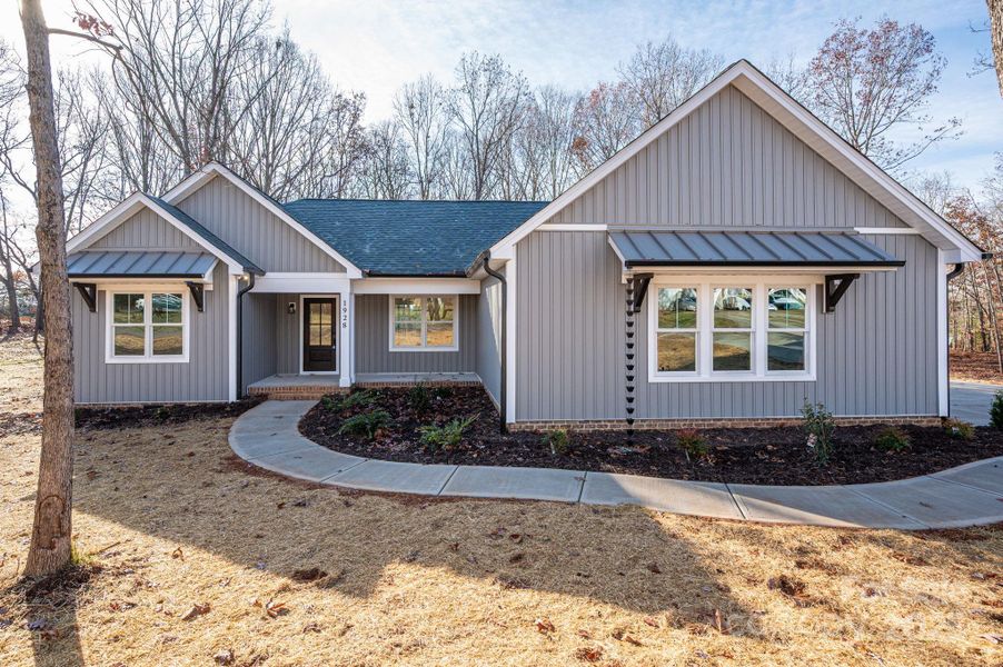 Front exterior of a new home in , Newton, NC, highlighting curb appeal (Image 18).