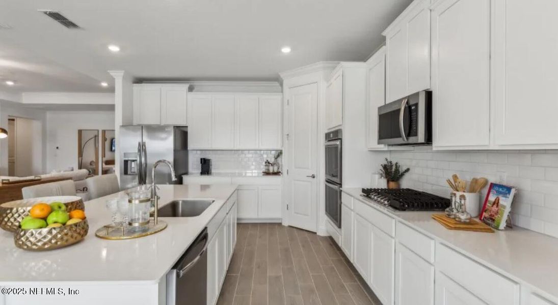 Furnished interior view inside a new home in Silver Meadows at SilverLeaf: Silver Meadows 60s, St. Augustine (Image 11). Furnished interior view inside a new home in Silver Meadows at SilverLeaf: Silver Meadows 60s, St. Augustine (Image 11).