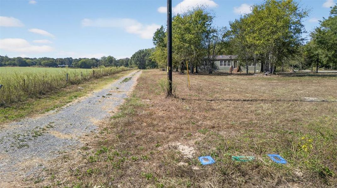 View of dirt / gravel road featuring a rural view View of dirt / gravel road featuring a rural view